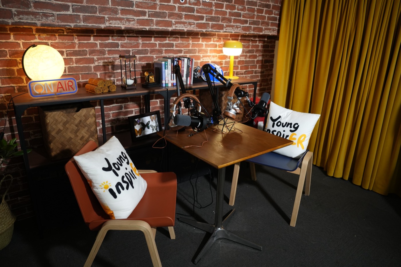 Studio corner with warm lights and YoungInspirer logo